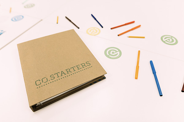 CO.STARTERS binder and colorful pencils
