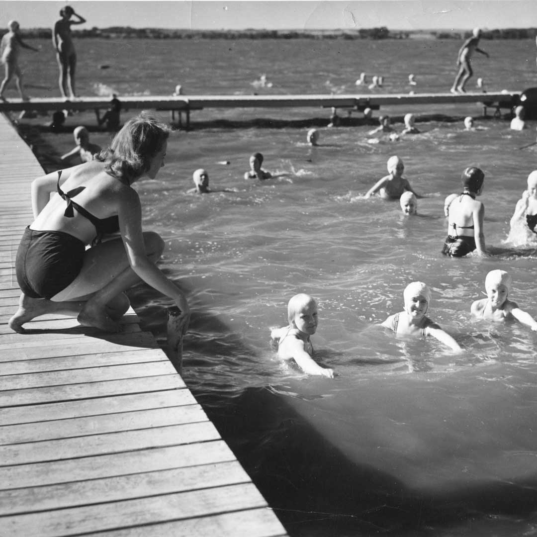 YWCA women swimming at lake in black and white photo
